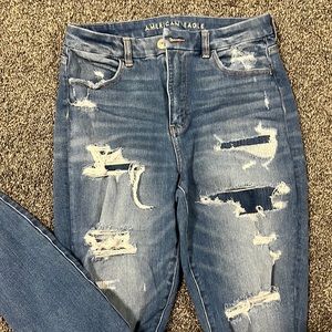 American Eagle Women’s Destructed Denim Size 10. High Rise curvy Jegging.